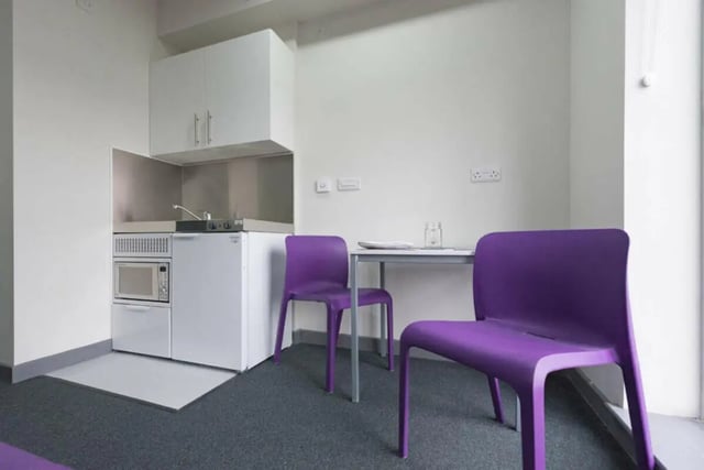 Compact kitchen with microwave fridge and dining area kitchen at Stoke Student Village in Stoke-On-Trent Student Accommodation