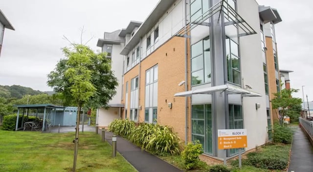 Modern student accommodation building with bike racks exterior at Exeter One in Exeter Student Accommodation