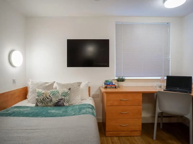 Bed desk TV and blinds student bedroom at Exeter One in Exeter Student Accommodation