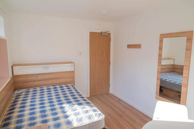 Bed with checkered bedding and headboard bedroom at MSV South in Manchester Student Accommodation