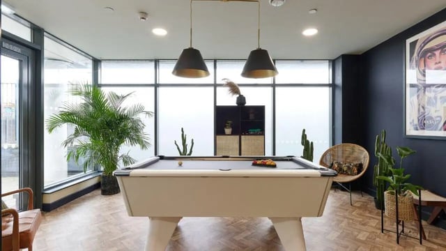 Pool table plants chairs artwork playing area at Heantun Point in Wolverhampton Student Accommodation