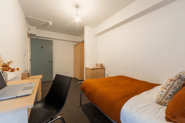 Bed desk wardrobe and chair bedroom at The Grafton in Manchester Student Accommodation