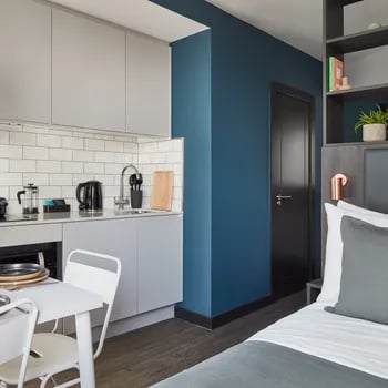 Studio kitchen and bed area at ARK Canary Wharf in London Student Accommodation