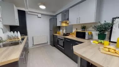 Modern kitchen with appliances sink and counter kitchen at iQ Broderick House in Birmingham Student Accommodation