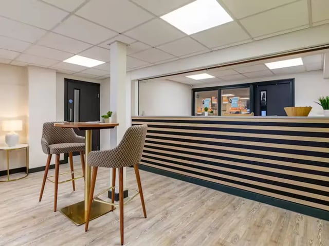 Two bar stools at high table reception area at Trinity Student Village in Preston Student Accommodation