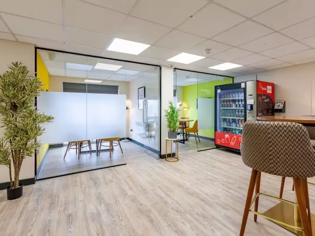 Vending machine tables chairs plants common area at Trinity Student Village in Preston Student Accommodation