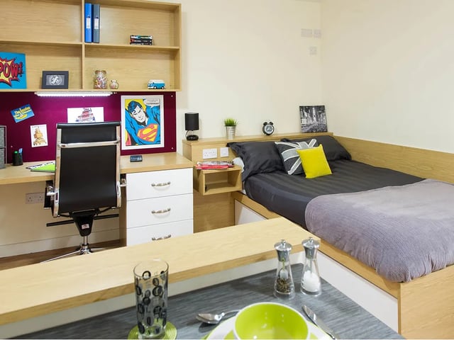Desk bed shelving and chair student bedroom at Quebec House in Kingston Upon Thames Student Accommodation