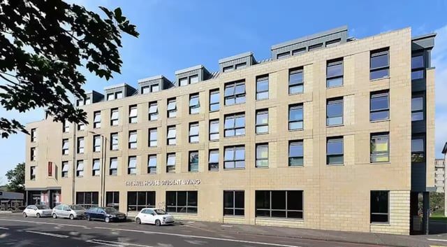 Modern brick building with many windows exterior at The Mill House in Edinburgh Student Accommodation