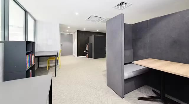 Bookshelf desks and booth seating study area at The Mill House in Edinburgh Student Accommodation