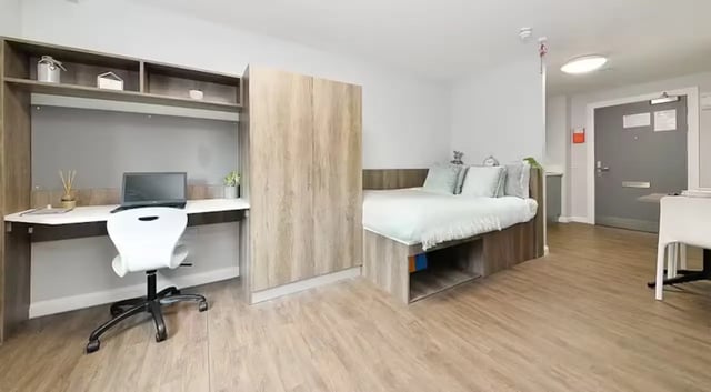 Desk bed wardrobe and door bedroom at The Mill House in Edinburgh Student Accommodation