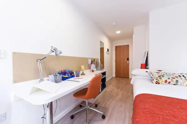 Desk with lamp chair bed and door Bedroom at The Towpath in Chester Student Accommodation