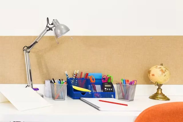 Desk with lamp pens globe calculator study area at The Towpath in Chester Student Accommodation