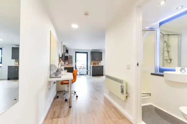 Study area with desk and chair kitchen and bathroom. at The Towpath in Chester Student Accommodation