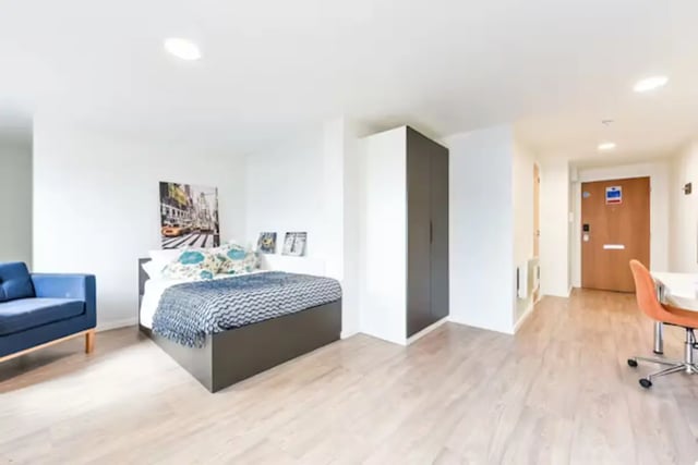 Blue sofa bed wardrobe door and desk Bedroom at The Towpath in Chester Student Accommodation
