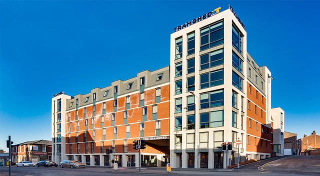 Modern student accommodation building with brick and white exterior exterior at The Tramshed in Preston Student Accommodation