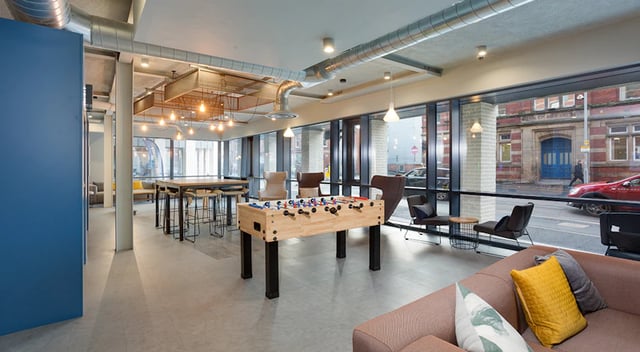 Foosball table sofas lounge chairs communal area at The Tramshed in Preston Student Accommodation