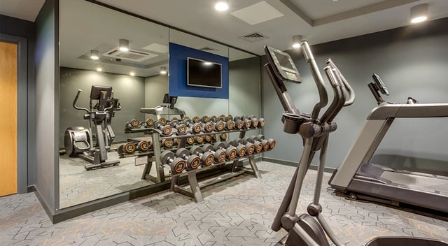 Treadmills ellipticals and dumbbell rack gym at The Tramshed in Preston Student Accommodation