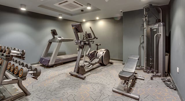 Dumbbells elliptical treadmill weight bench gym at The Tramshed in Preston Student Accommodation