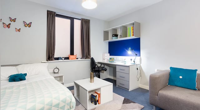 Bed desk sofa and coffee table room at The Tramshed in Preston Student Accommodation