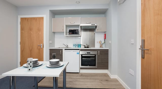 Kitchenette with table and chairs kitchen area at The Tramshed in Preston Student Accommodation