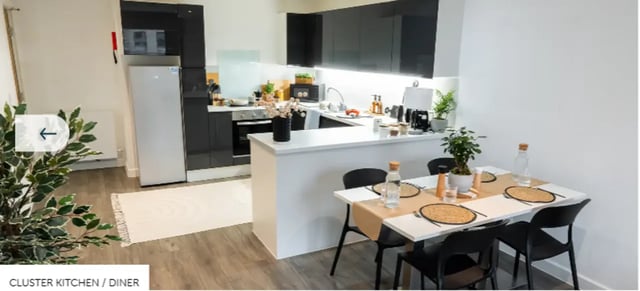 Kitchen diner with white table and chairs at Palamon Court in Canterbury Student Accommodation