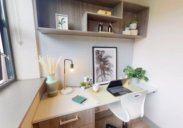 Desk with laptop and art print study area at Waterlane House in Bristol Student Accommodation
