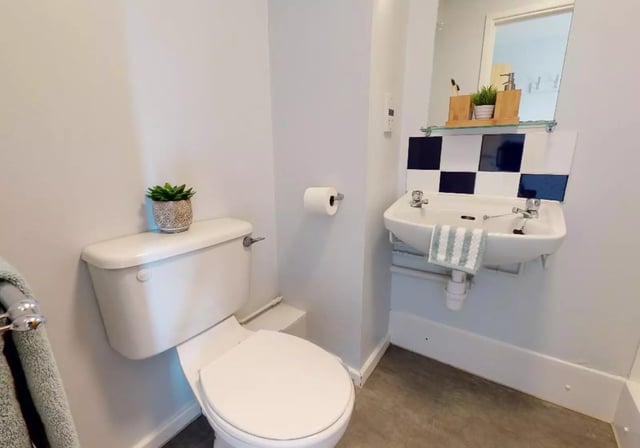 Toilet sink and towel student accommodation bathroom at Opal Court Leicester in Leicester Student Accommodation