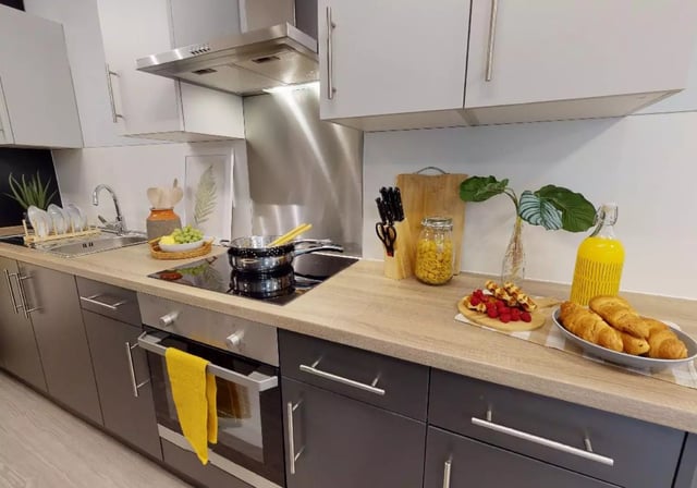 Countertop with food and cookware kitchen at iQ Will Wyatt Court in London Student Accommodation