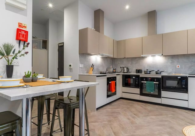 Dining table stools cabinets appliances kitchen at iQ Vega London in London Student Accommodation
