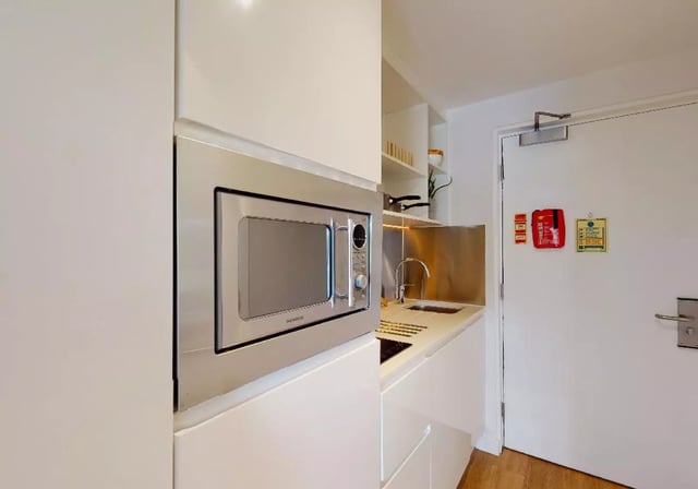 Microwave sink and cabinets modern kitchen at iQ Flinders House in London Student Accommodation