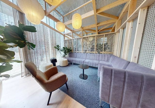 Secured lounge area with sectional sofa coffee table living room at iQ East Court in London Student Accommodation