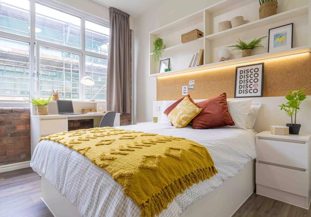 Bed desk shelving with plants disco art bedroom at iQ Fletcher House in Manchester Student Accommodation