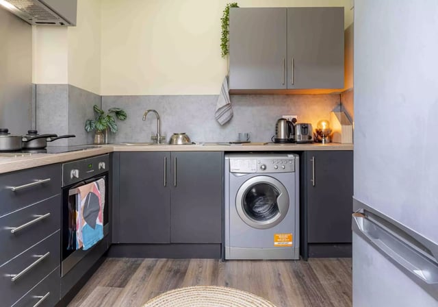 Modern kitchen with washing machine oven sink kitchen at iQ Fletcher House in Manchester Student Accommodation
