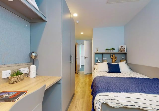 Desk bed wardrobe and hallway bedroom at iQ Nelson Court in Nottingham Student Accommodation
