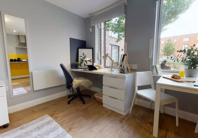 Desk chair mirror laptop and desk study area at iQ The Brickworks in York Student Accommodation