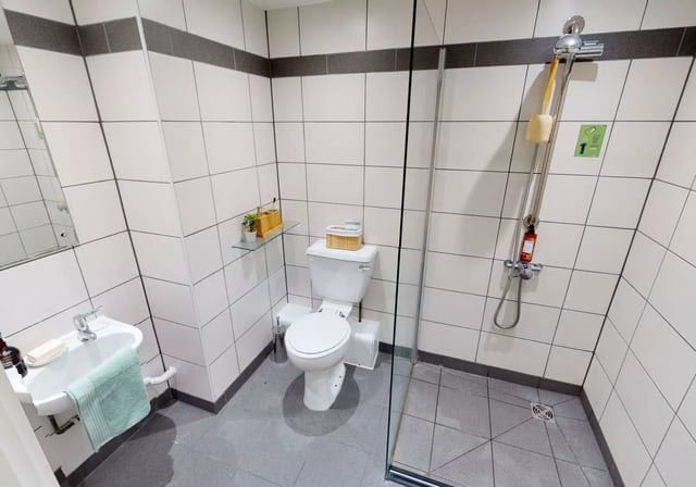 Sink toilet shower and toiletries bathroom at iQ The Brickworks in York Student Accommodation