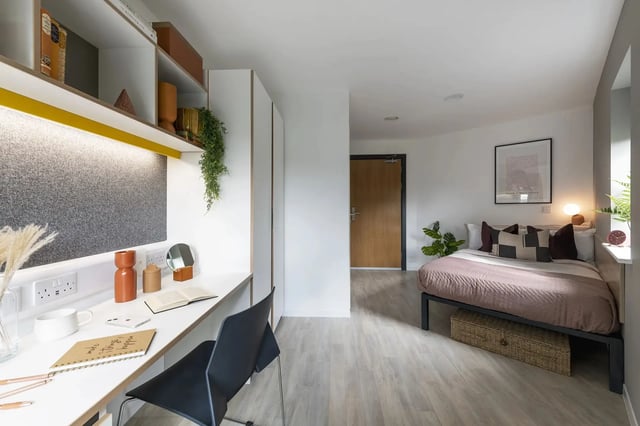 Desk bed chair and shelves student studio bedroom at Altura Birmingham in Birmingham Student Accommodation