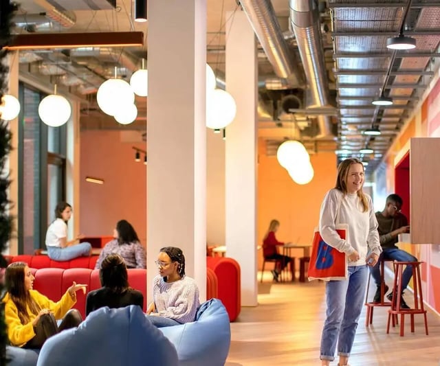 Students relaxing and studying in common area at Scape Mile End Canalside in London Student Accommodation