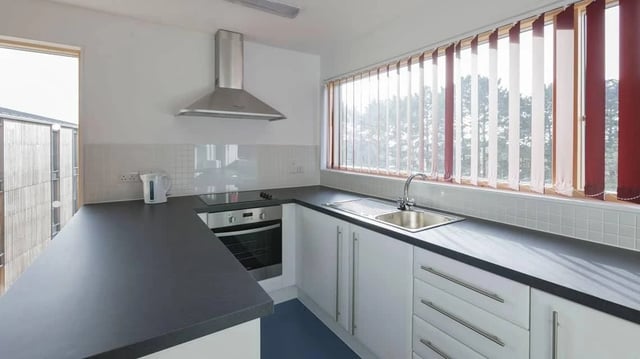 Countertops cabinets sink oven kettle kitchen at Treliske Key Workers in Truro Student Accommodation