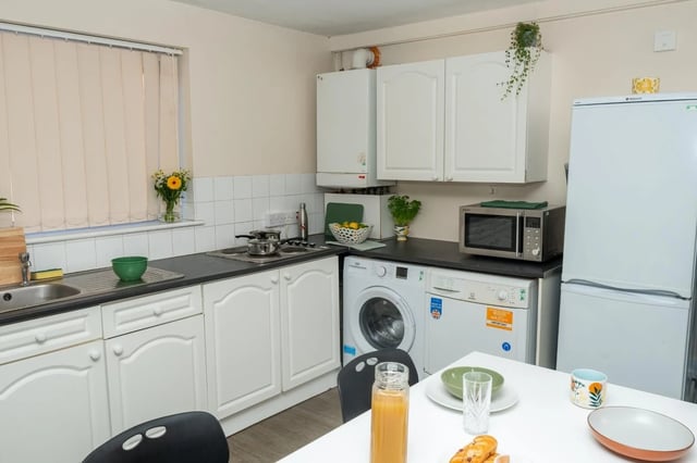 Sink washing machine microwave fridge kitchen at Grange Court & The Ridings in Ormskirk Student Accommodation