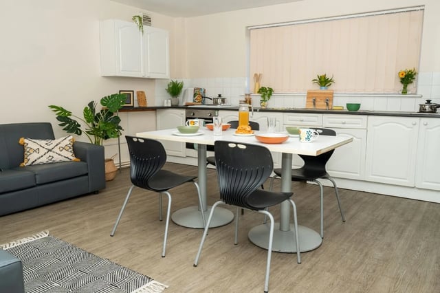 Sofa table chairs plants and kitchen area living kitchen at Grange Court & The Ridings in Ormskirk Student Accommodation