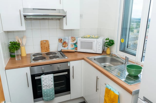 Kitchenette with oven stove microwave sink kitchen Image Type at Wardley House Key Workers in Bradford Student Accommodation