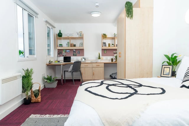 Desk chair laptop shelves and bed bedroom at Wardley House Key Workers in Bradford Student Accommodation