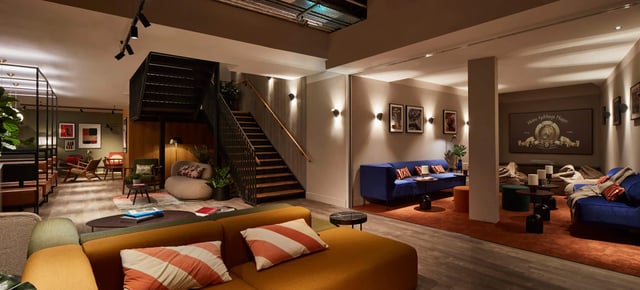 Sofas stairs and art living room at Tribu Kingston in Kingston Upon Thames Student Accommodation