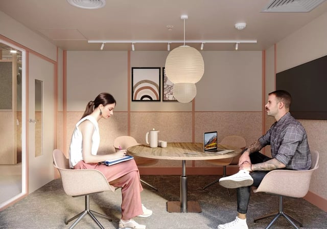 Two people at a round table study area at Longwood Place in Coventry Student Accommodation