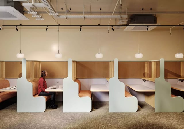 Individual study pods with woman and laptop study area at Longwood Place in Coventry Student Accommodation