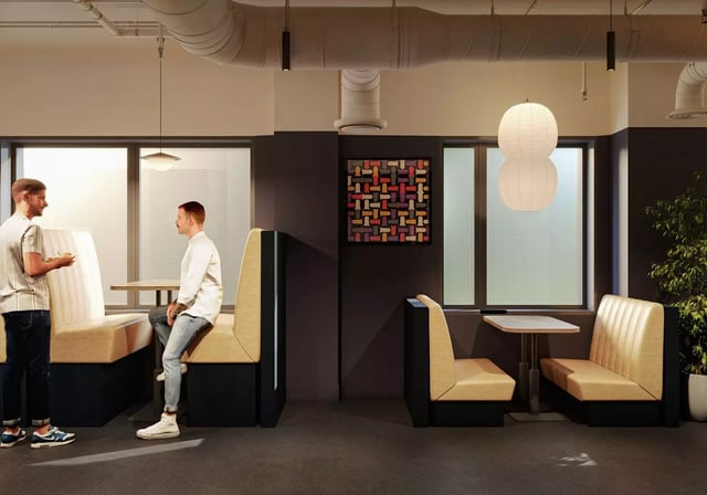 Booths with tables and people communal area at Longwood Place in Coventry Student Accommodation