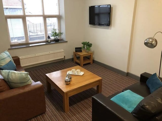Two sofas coffee table TV living room at Millfield House in Sunderland Student Accommodation