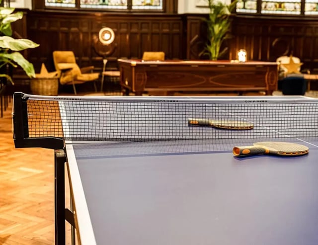 Ping pong table paddles and net playing area at John Bell House in Belfast Student Accommodation