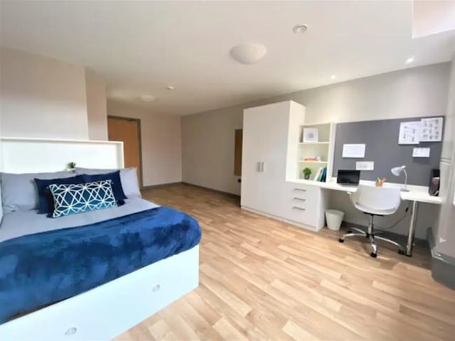 Bed study desk wardrobe and noticeboard bedroom at John Bell House in Belfast Student Accommodation